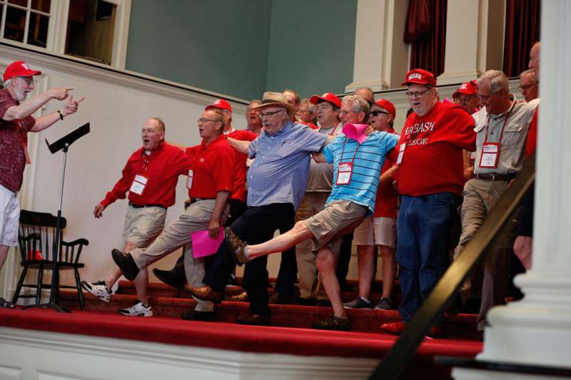 a group of people in red shirts