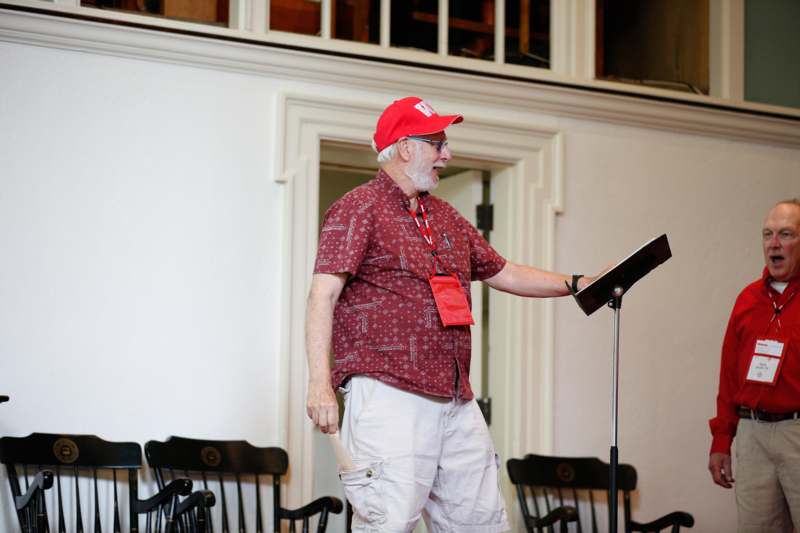 a man standing in front of a microphone