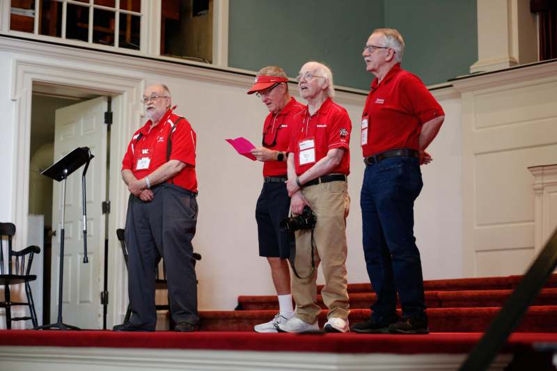 a group of men wearing red shirts