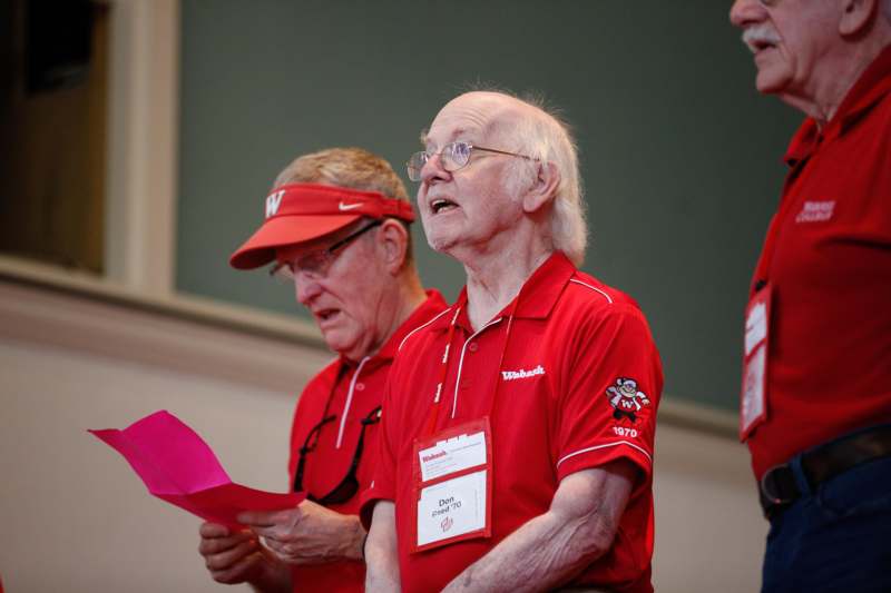 a group of men wearing red shirts