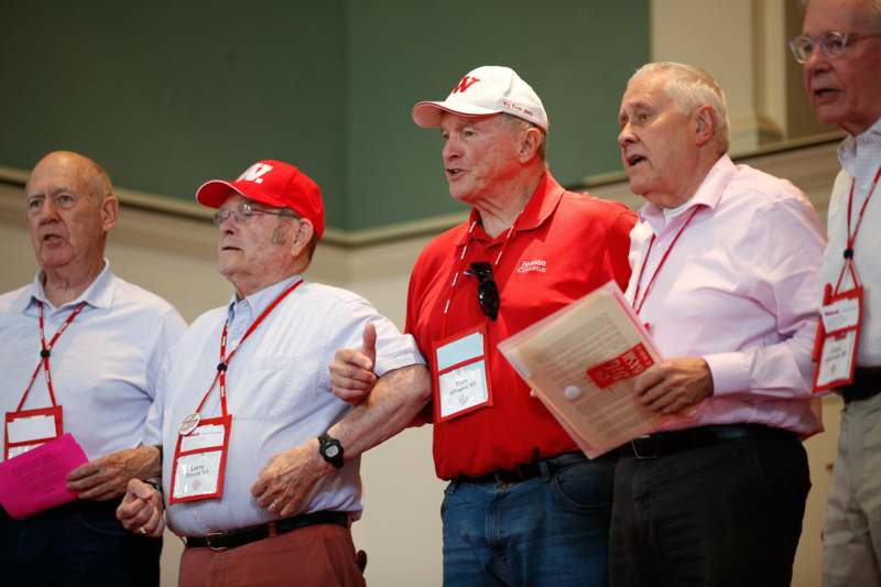 a group of men wearing badges
