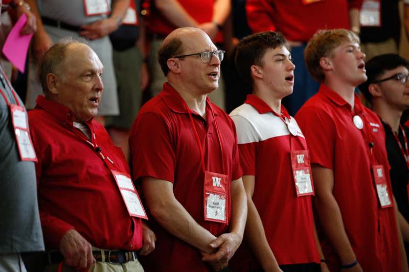 a group of men wearing red shirts