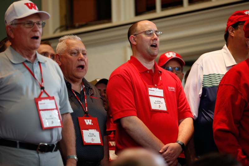 a group of men wearing name tags