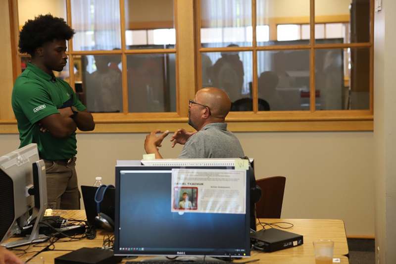 a man talking to another man