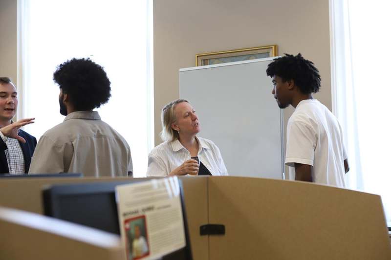 a group of people standing in a room