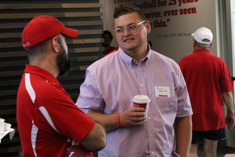 a group of men in red shirts