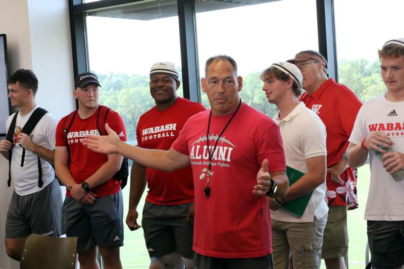 a group of men in red shirts