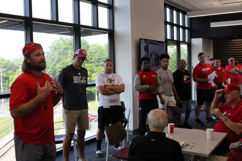a group of men standing in a room