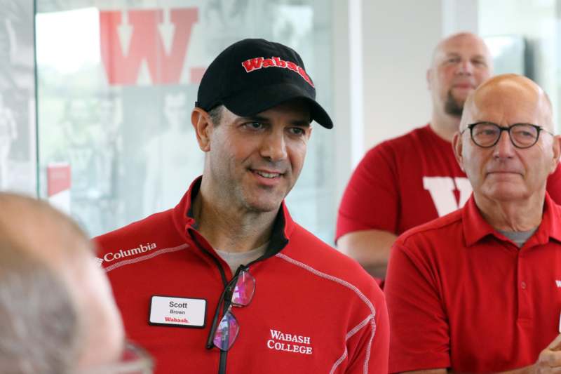 a group of men in red shirts