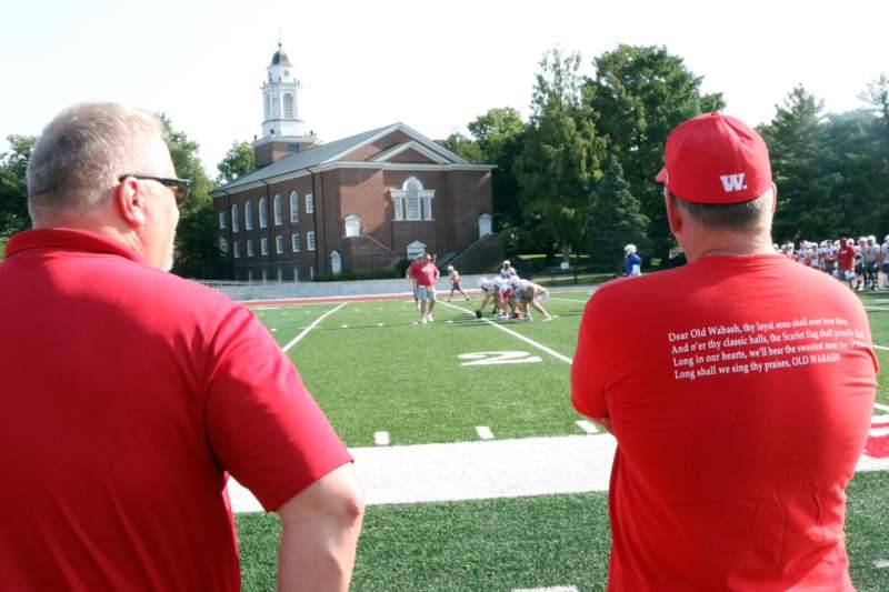 a group of people on a football field