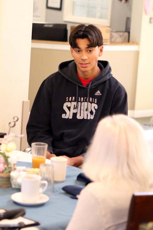 a man sitting at a table with a woman