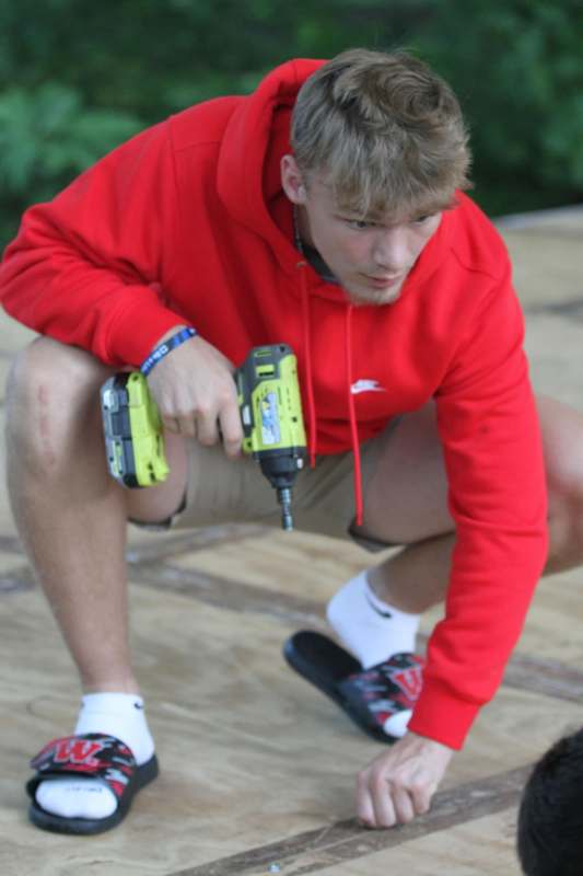 a man holding a drill