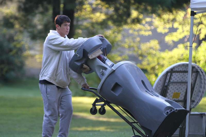 a man pushing a large object