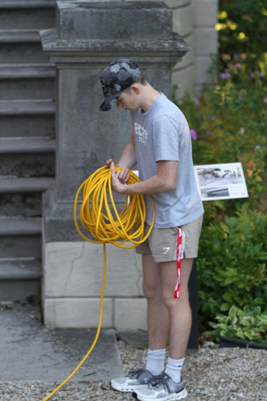 a man holding a yellow tube