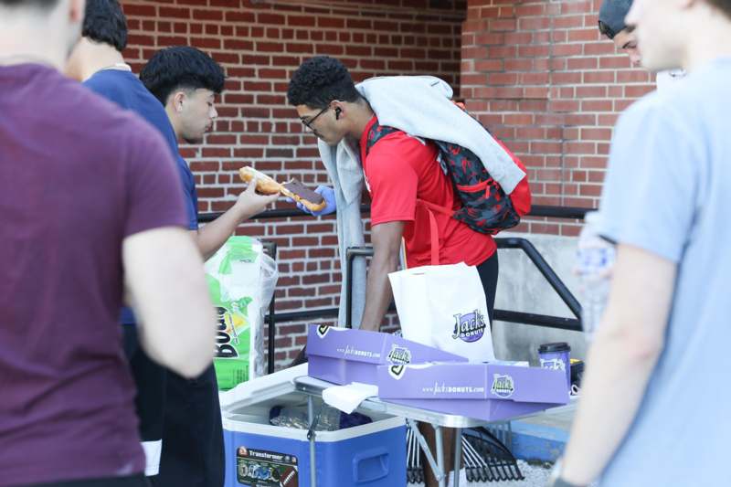 a man eating a hot dog