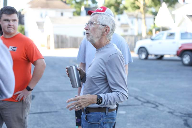 a man holding a cup
