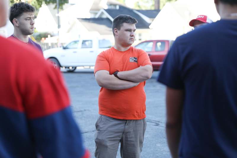 a man standing with his arms crossed