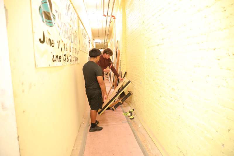 a group of people standing in a hallway