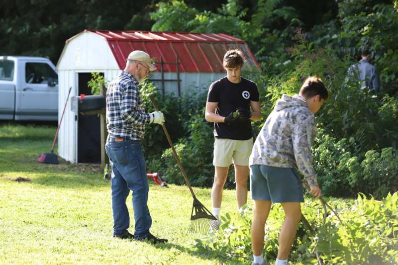 a group of people working in a yard