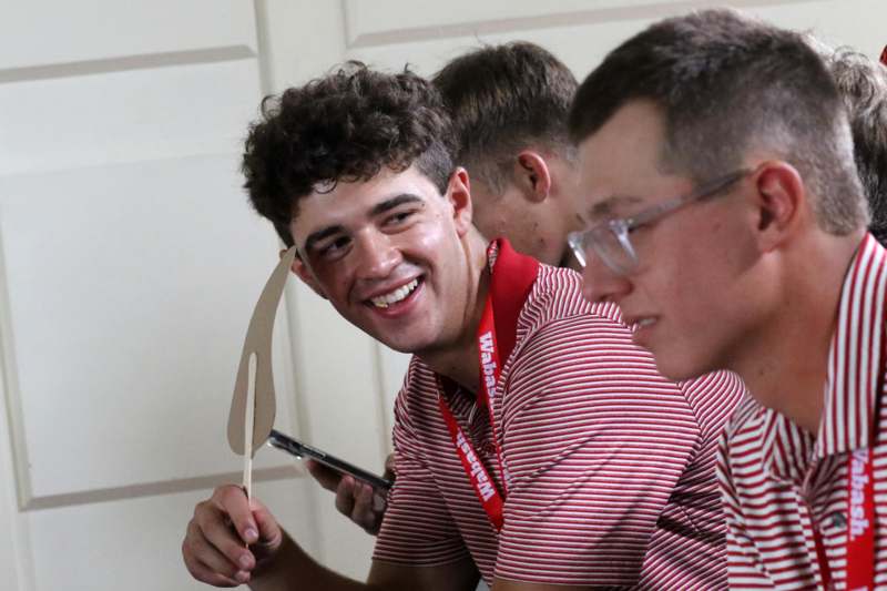 a group of men smiling