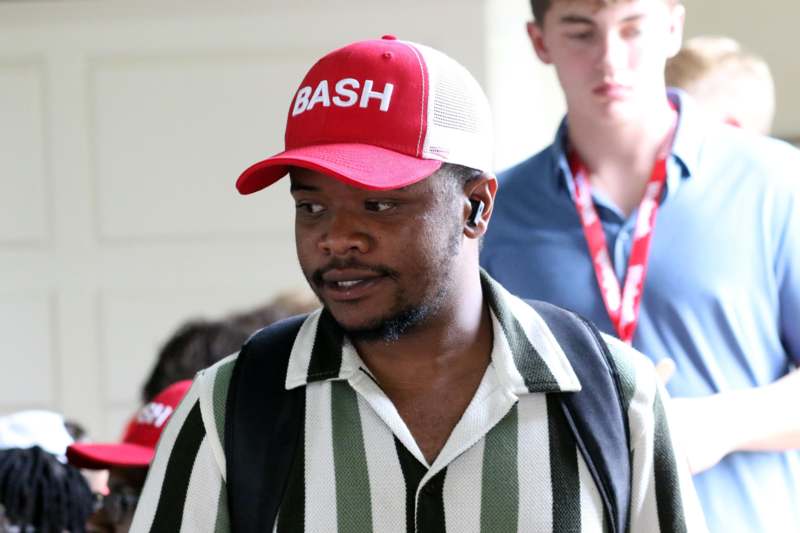 a man wearing a red hat
