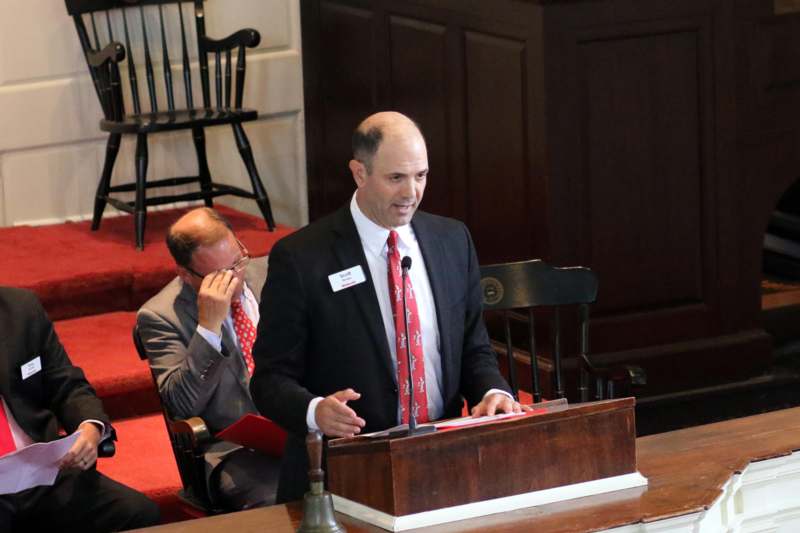 a man standing at a podium