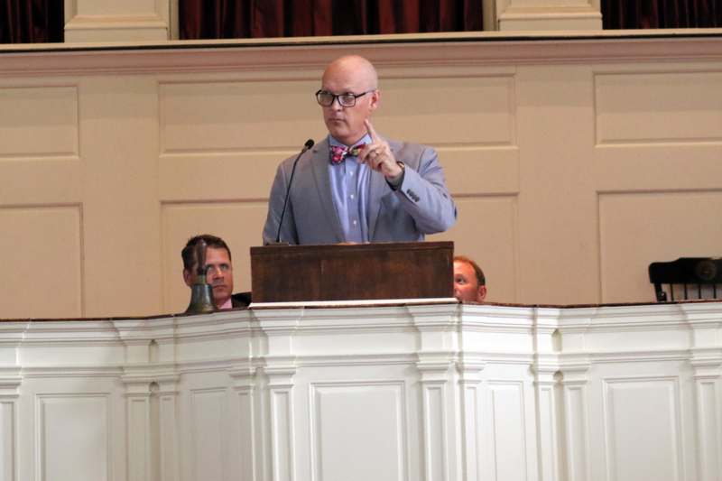 a man standing at a podium
