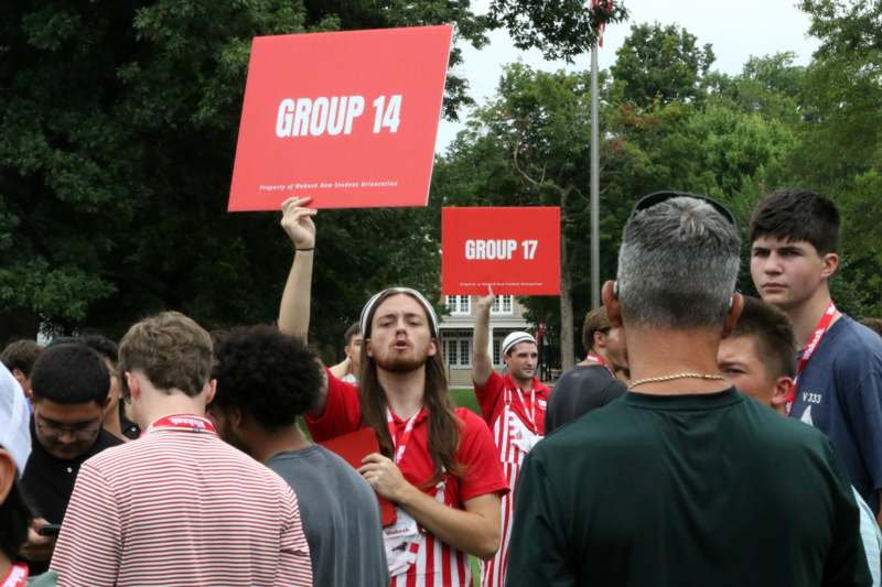a group of people holding signs
