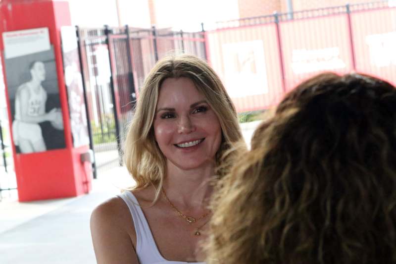 a woman smiling at another woman