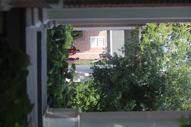 two people walking in a courtyard