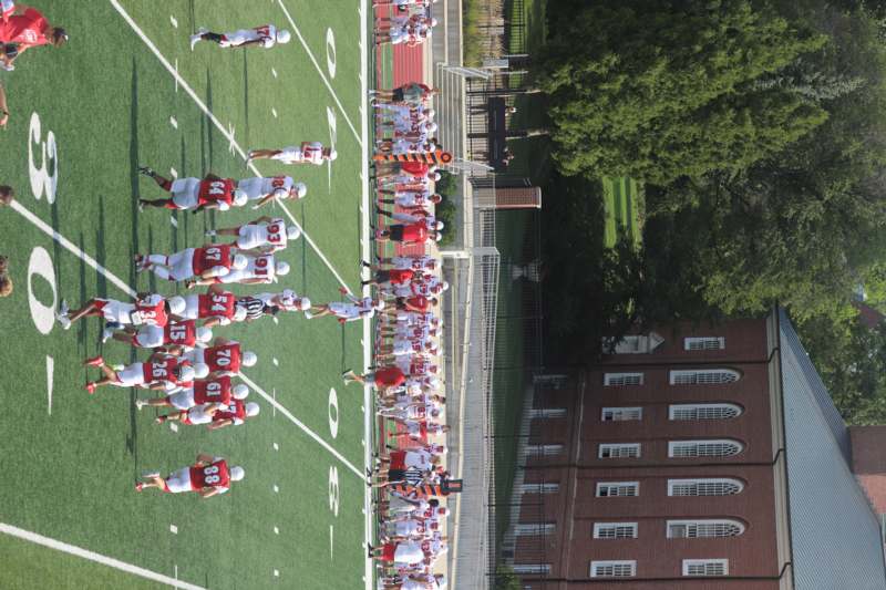 a group of people on a football field