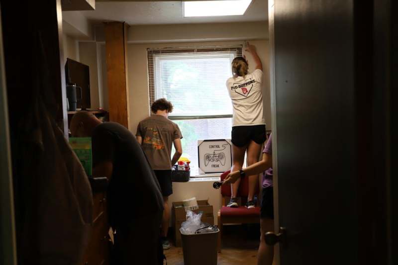 a group of people standing in a room