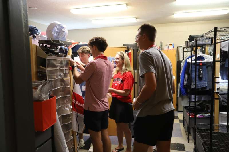 a group of people standing in a room