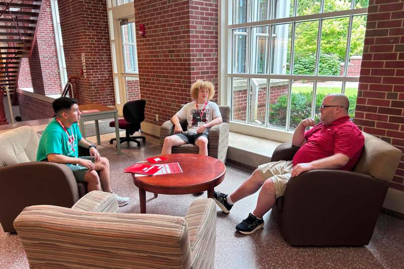 a group of people sitting in chairs