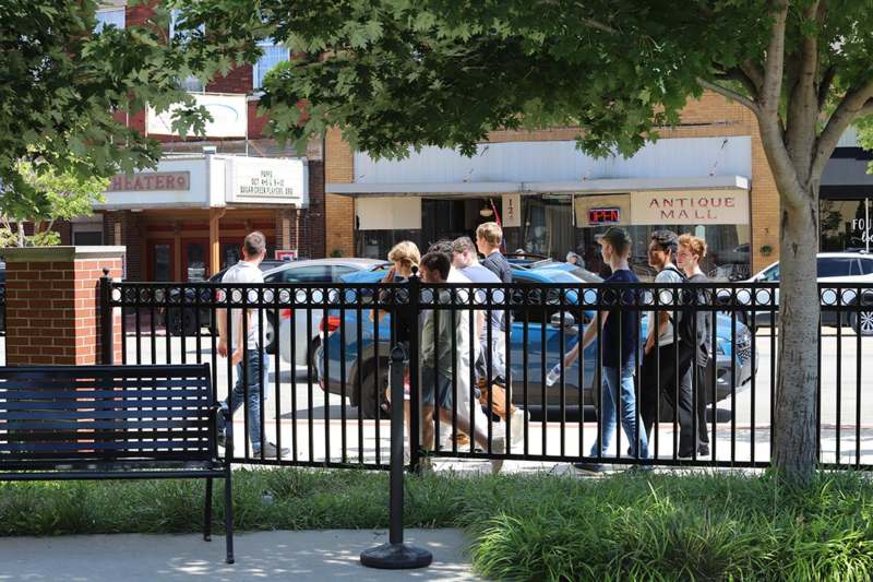 a group of people standing in a line