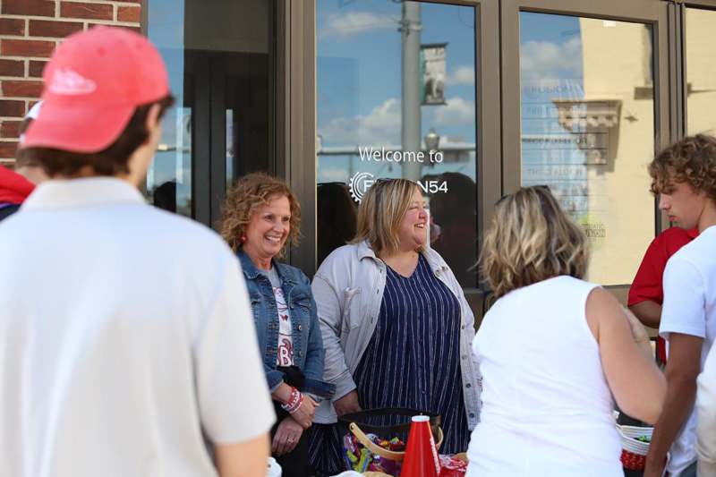a group of people standing outside a building
