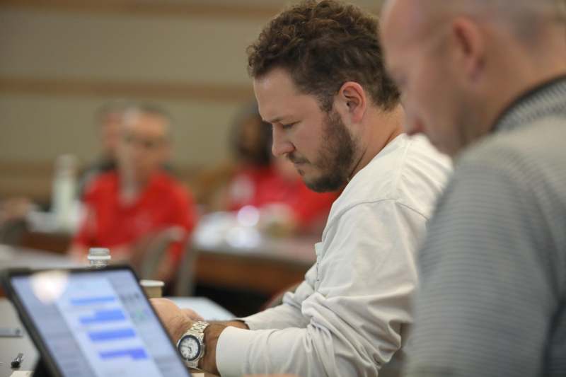 a man looking at a laptop
