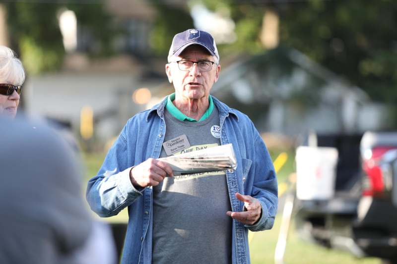 a man holding a newspaper