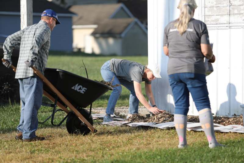 a group of people cleaning a house