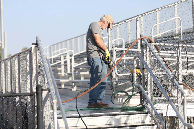 a man holding a hose