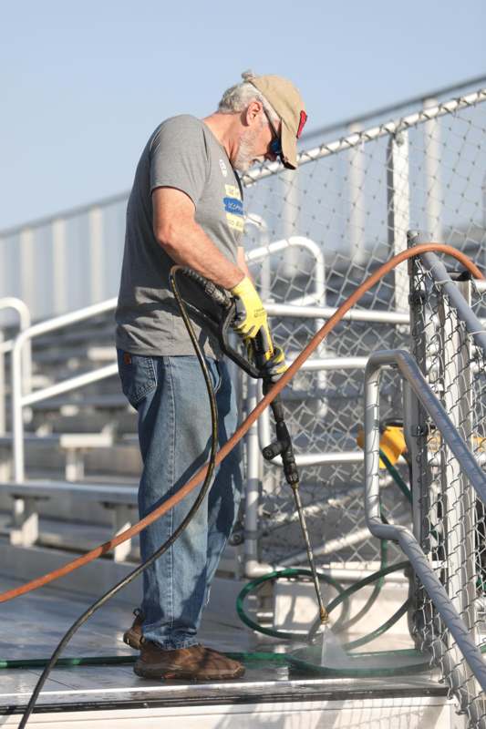 a man holding a hose