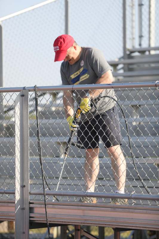 a man holding a power drill