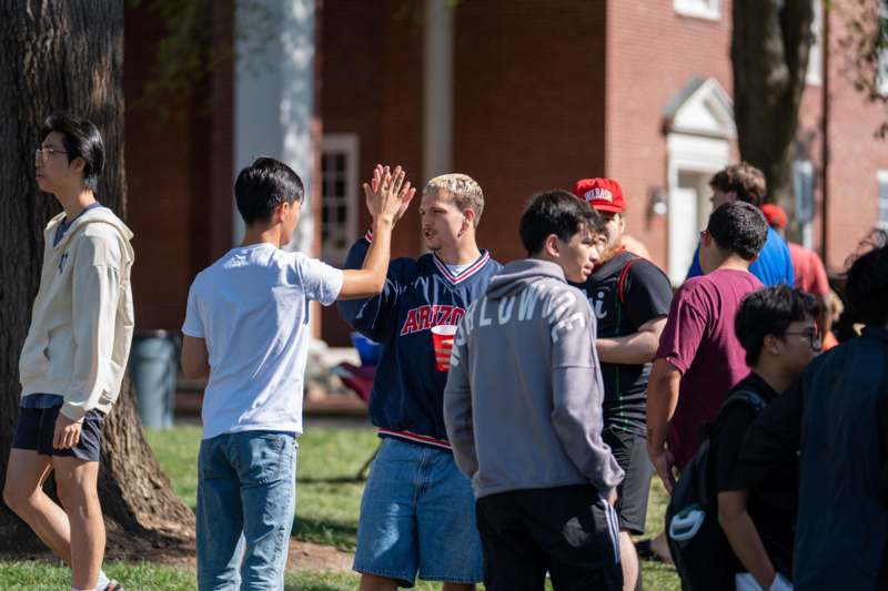 a group of people high fiving