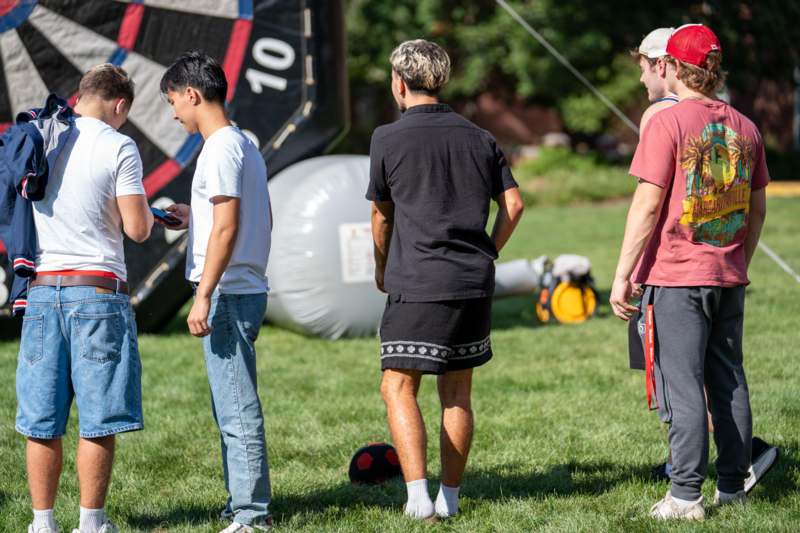 a group of people standing in a field