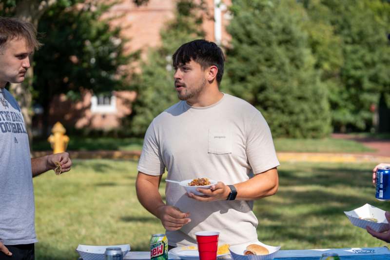 a man holding a plate of food