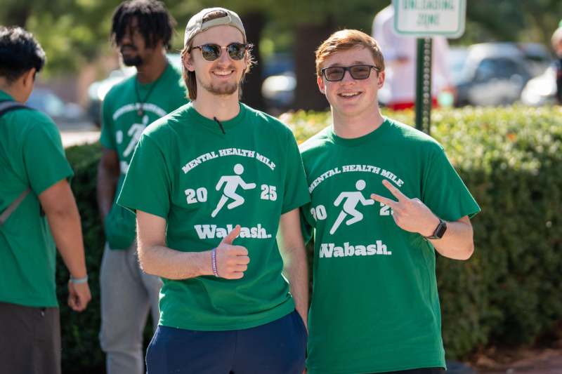 a group of men wearing green shirts