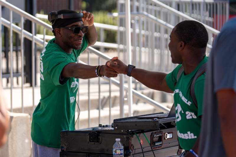 a man shaking hands with another man