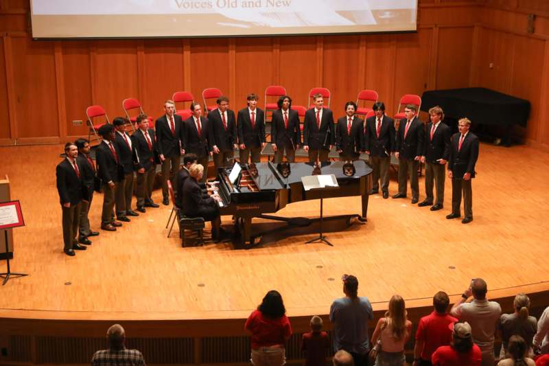 a group of people standing on a stage
