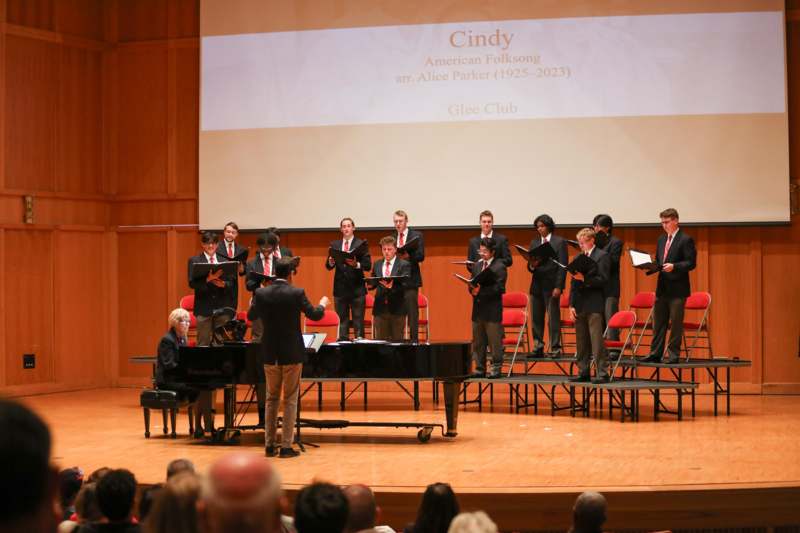 a group of people performing on stage