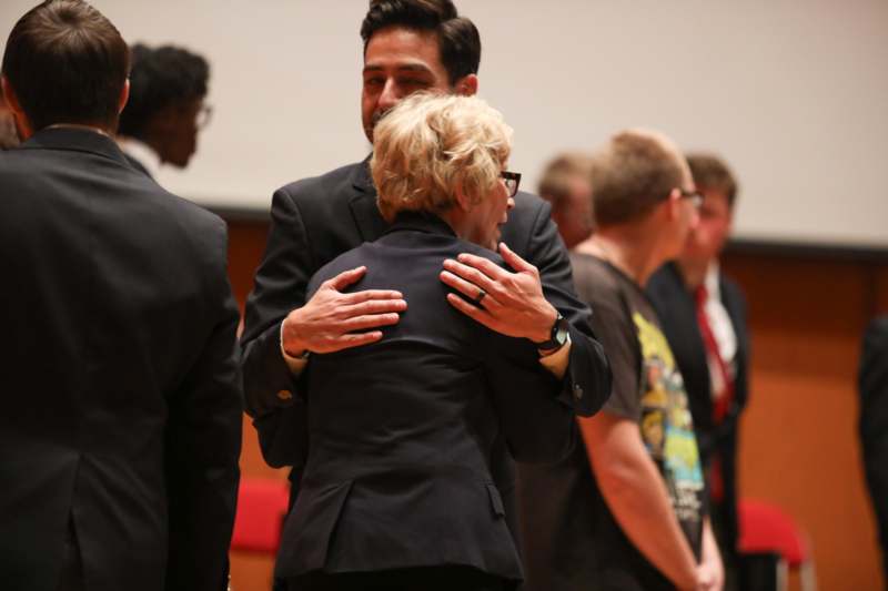 a man hugging a woman